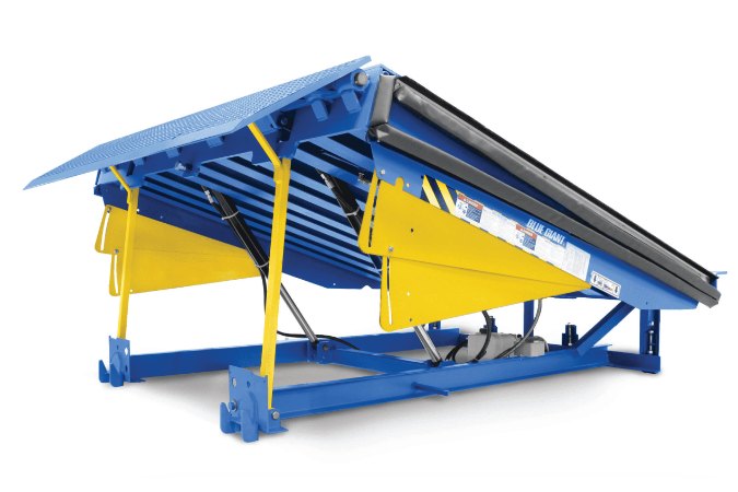 Blue Giant Canadian-made hydraulic dock leveler raised showing blue steel deck, yellow safety legs, and hydraulic cylinders